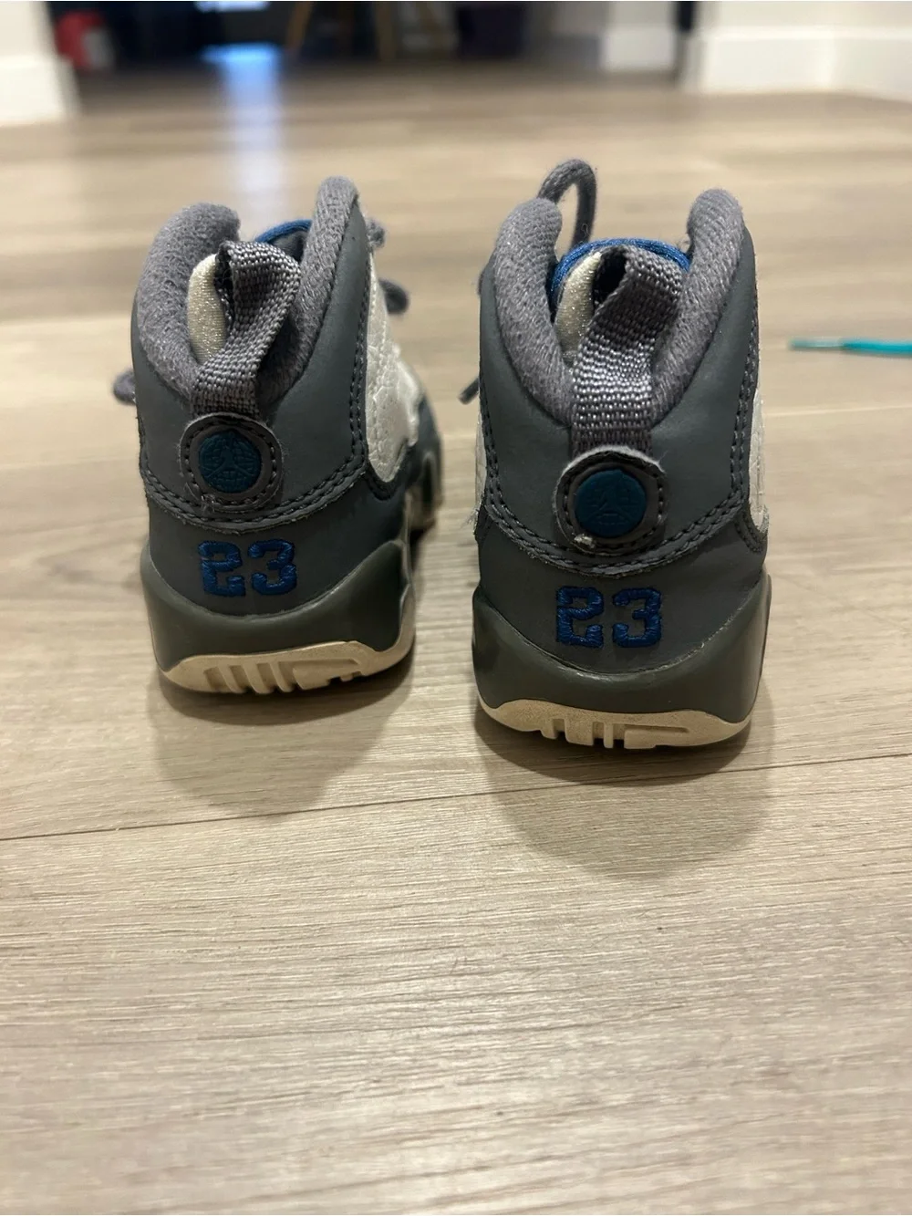 Jordan Kids White and Gray Retro Sneaker with Blue Eyelets